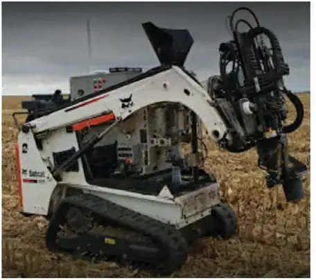 Robotic Bobcat soil sampling vehicle in a harvested field