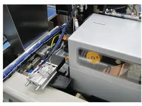 Zebra RFID label printer integrated into a robotic bagging cell with pneumatic tubing