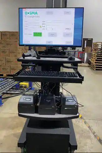 Newcastle mobile cart with a large monitor, keyboard, and three Zebra ZD420 printers