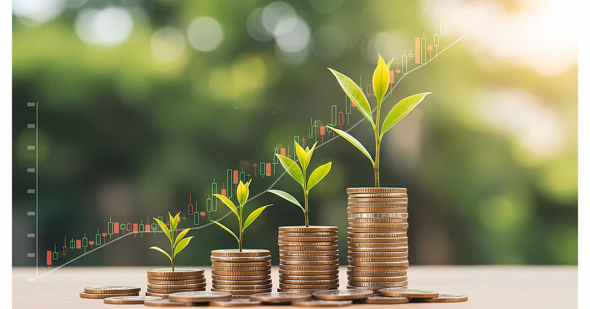 Stacks of coins with seedlings growing from them in front of a rising stock chart