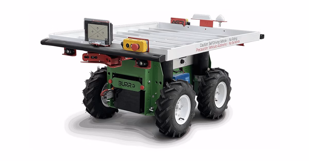 Burro autonomous field robot with a flat cargo deck, tablet, and emergency stop button
