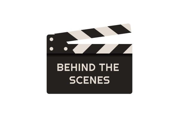 Black and white film clapperboard labeled Behind the Scenes