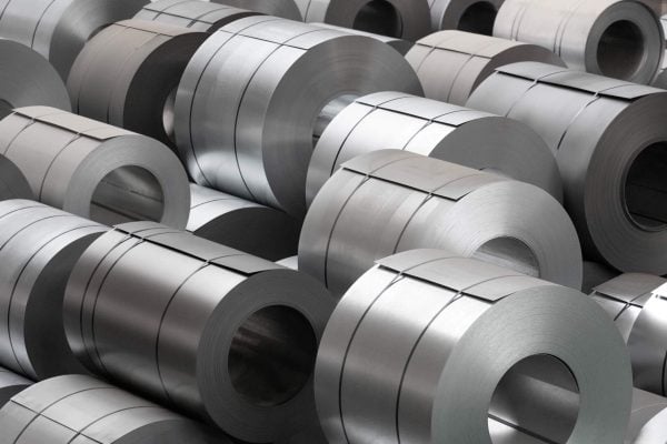 Stacked coils of rolled steel in a warehouse