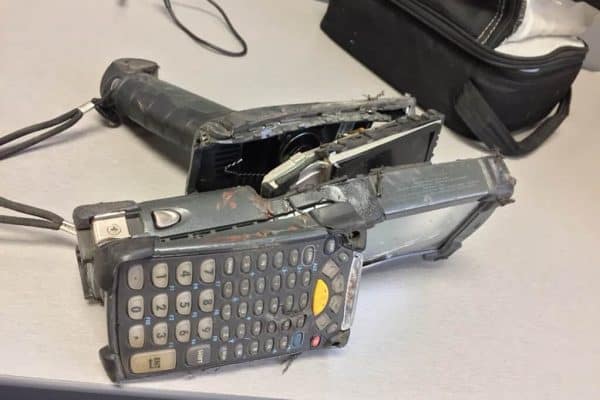 Badly damaged Zebra handheld mobile computer with a cracked case and broken keypad