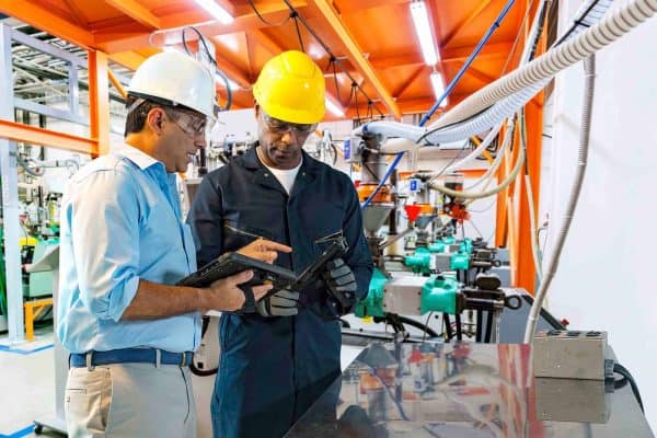 Home Hero Image Workers using mobile computers on shop floor