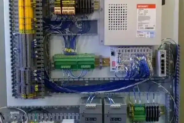 Industrial control panel with wiring, relays, and terminal blocks
