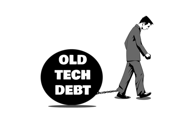 A man pulling a ball and chain behind him with the ball labeled as "Old Tech Debt"