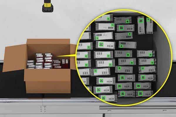 Fixed scanner reading multiple barcodes on packages inside an open carton on a conveyor