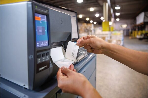 Someone calibrating a Zebra ZT231 Printer for RFID Labels